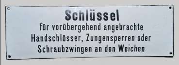 Emailleschild Schlüssel für vorübergehend angebrachte Handschlösser, Zungensperren oder Schraubzwingen an den Weichen